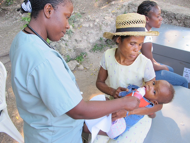 A nurse gives an infant Pedialyte at Polyclinique Camejo in Leogane, outside of Port-au-Prince.