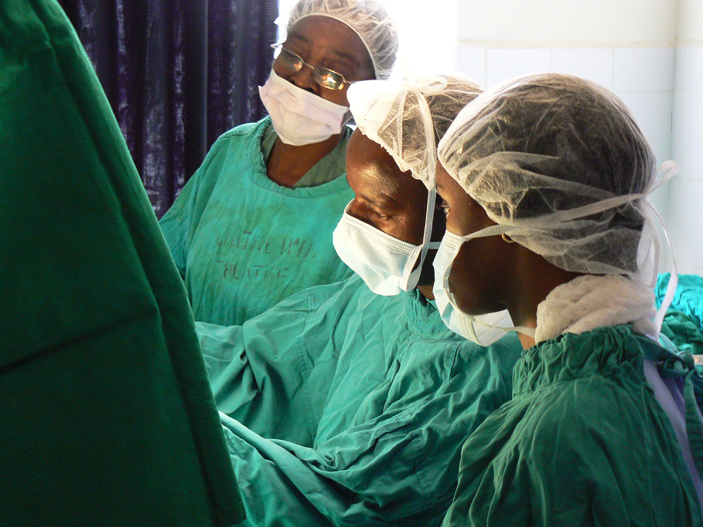 Dr. Mabeya (center) in surgery. Dr. Mabeya (center) in surgery.