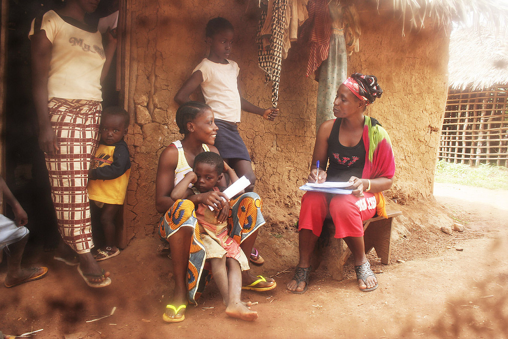 A frontline health worker with Tiyatien Health conducts a health survey with a family. Photo courtesy of Tiyatien Health. A frontline health worker with Tiyatien Health conducts a health survey with a family. Photo courtesy of Tiyatien Health.