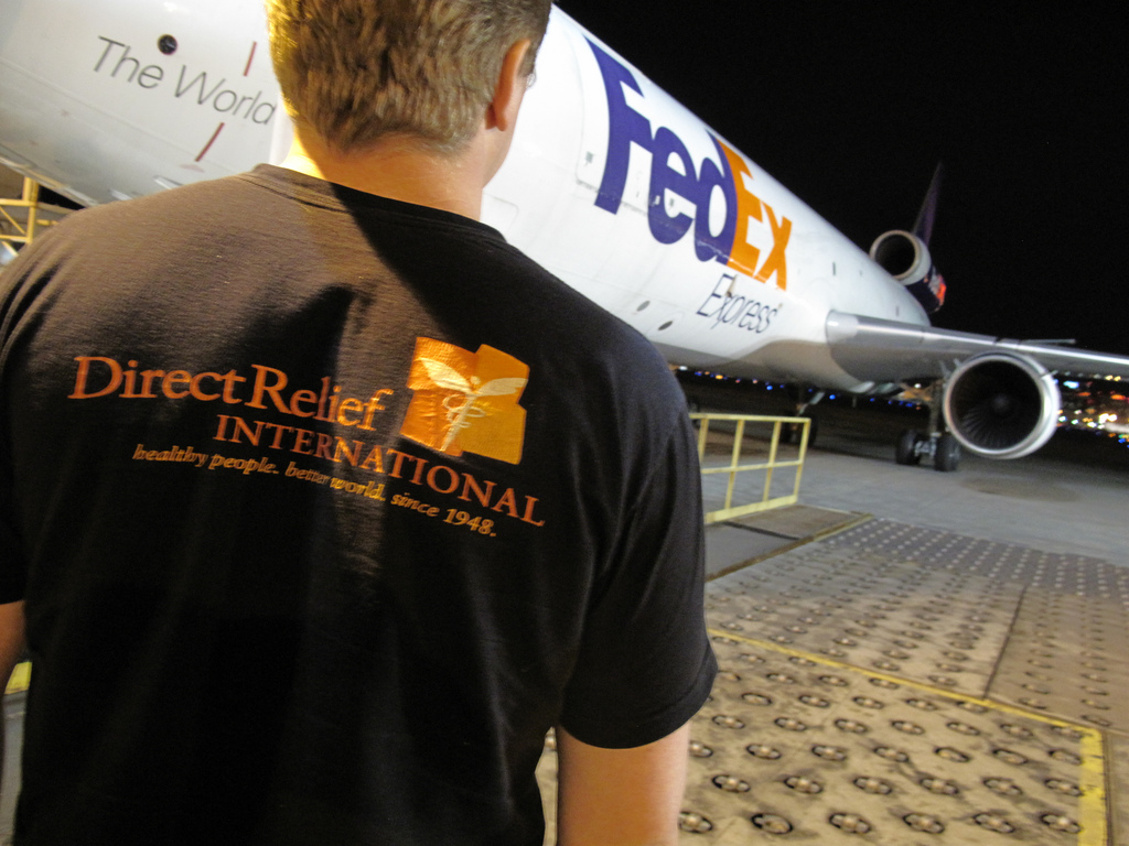 DRI staff and FedEx Plane