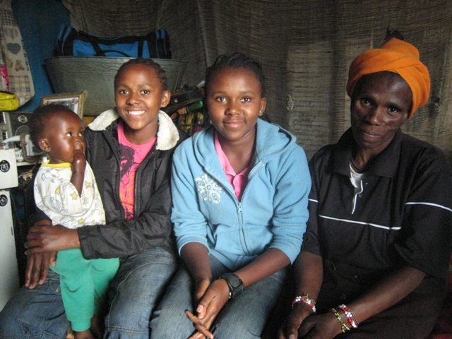 Gloria with daughters and grandchild