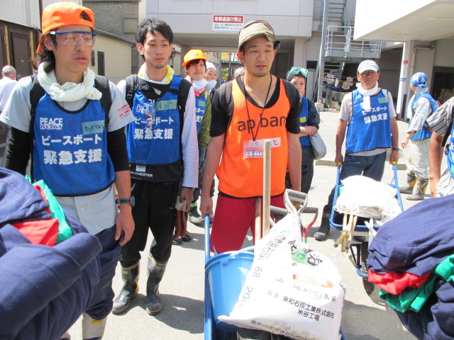 Peace Boat volunteers prepare for a day of debris removal on May 21, 2011