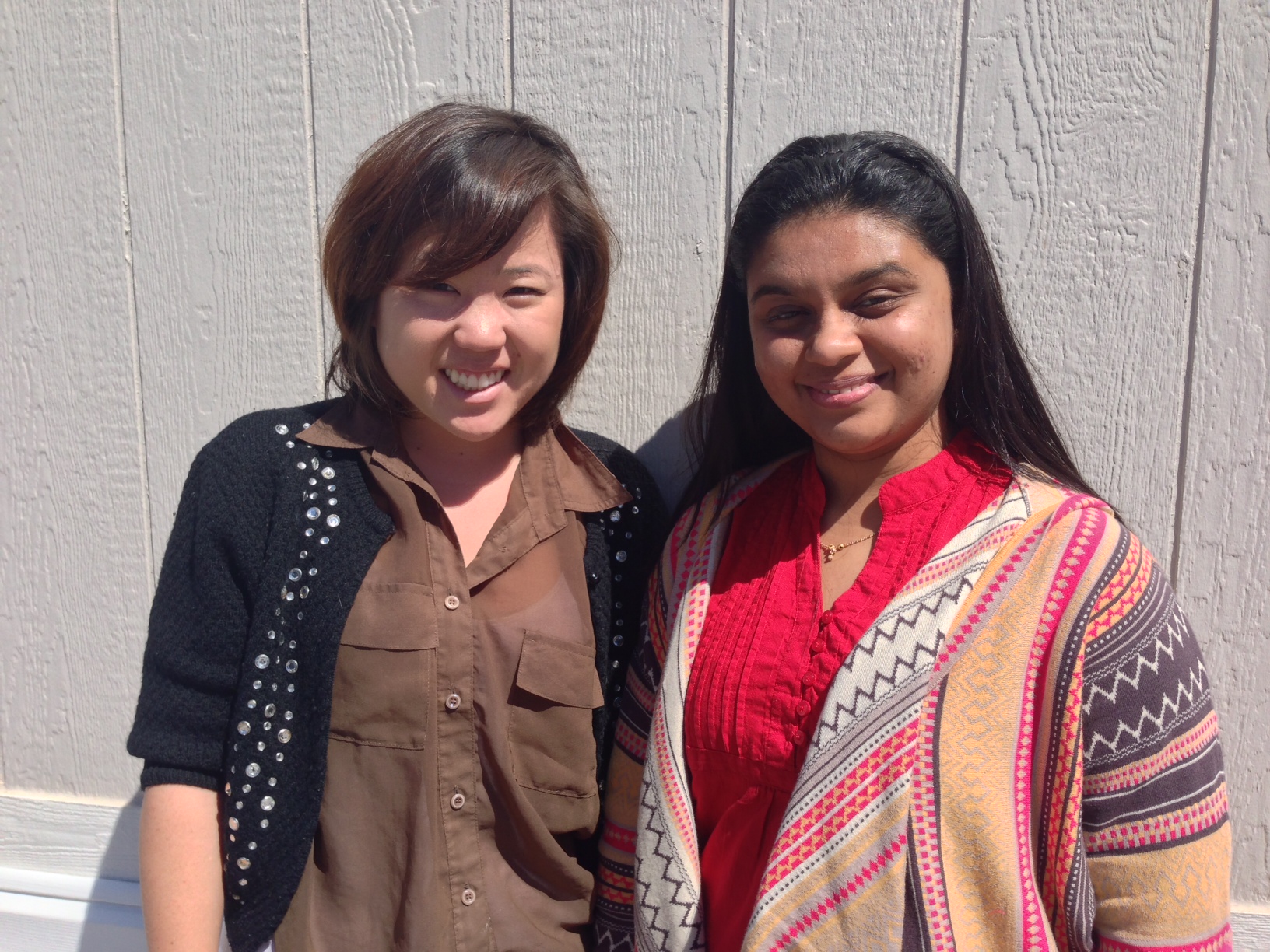 Lisa (left) and Shailja (right) smile outside of the IT trailer.