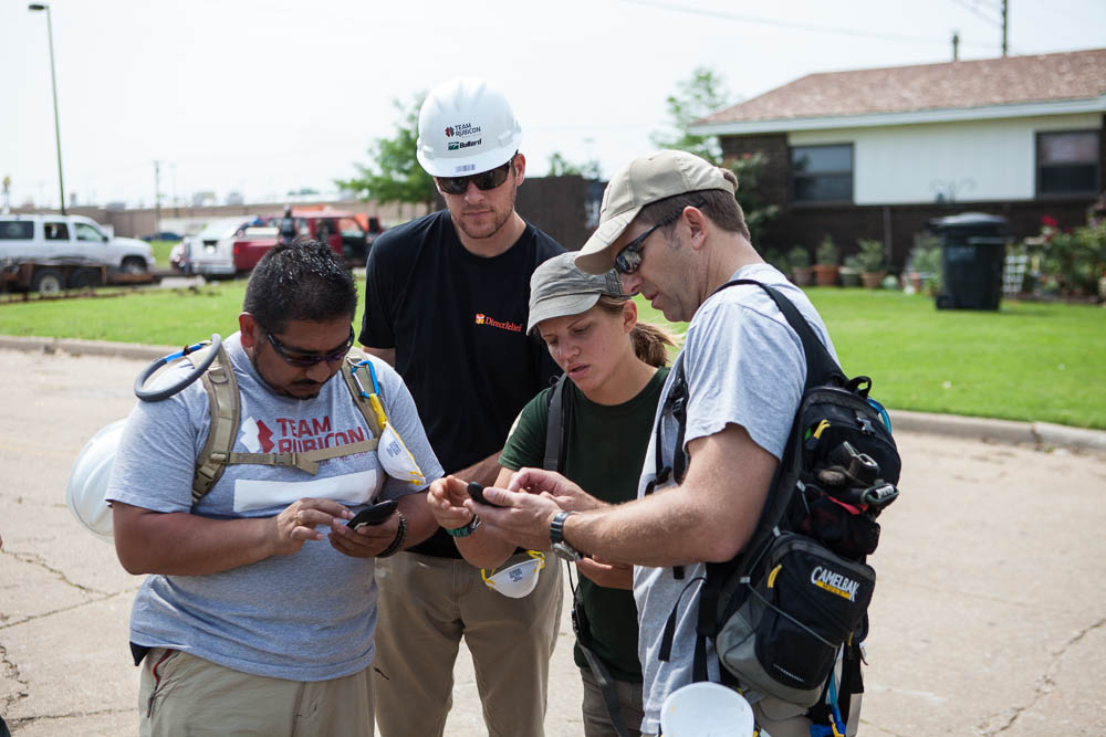 Andrew MacCalla (center) works with Team Rubicon on the ground in Moore, Okla. to conduct assessments and better help people in need. Andrew MacCalla (center) works with Team Rubicon on the ground in Moore, Okla. to conduct assessments and better help people in need.