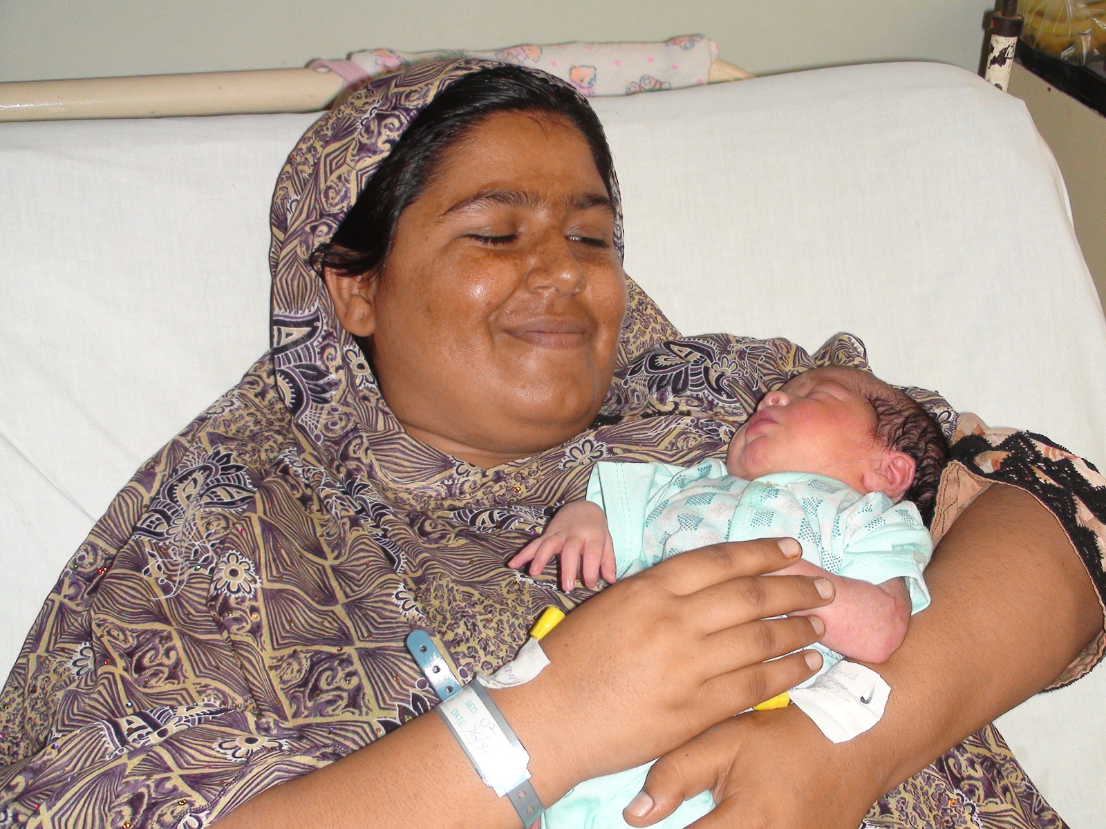 Wasila smiles with her baby. Photo courtesy of Murshid Hospital and Health Care Center.