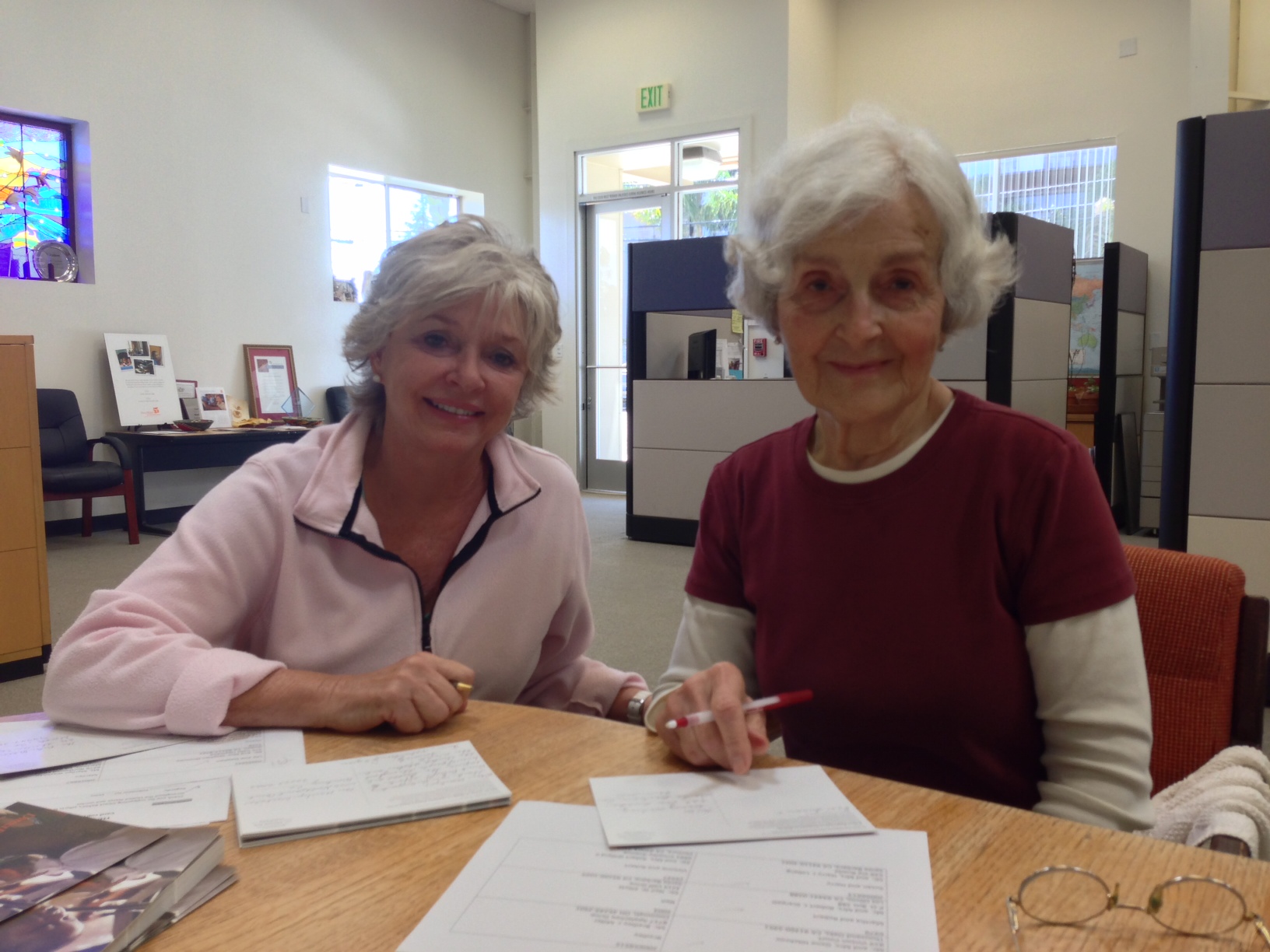 Ann (left) and Dolores (right) smile during a Tuesday morning letter-writing session. Ann (left) and Dolores (right) smile during a Tuesday morning letter-writing session.