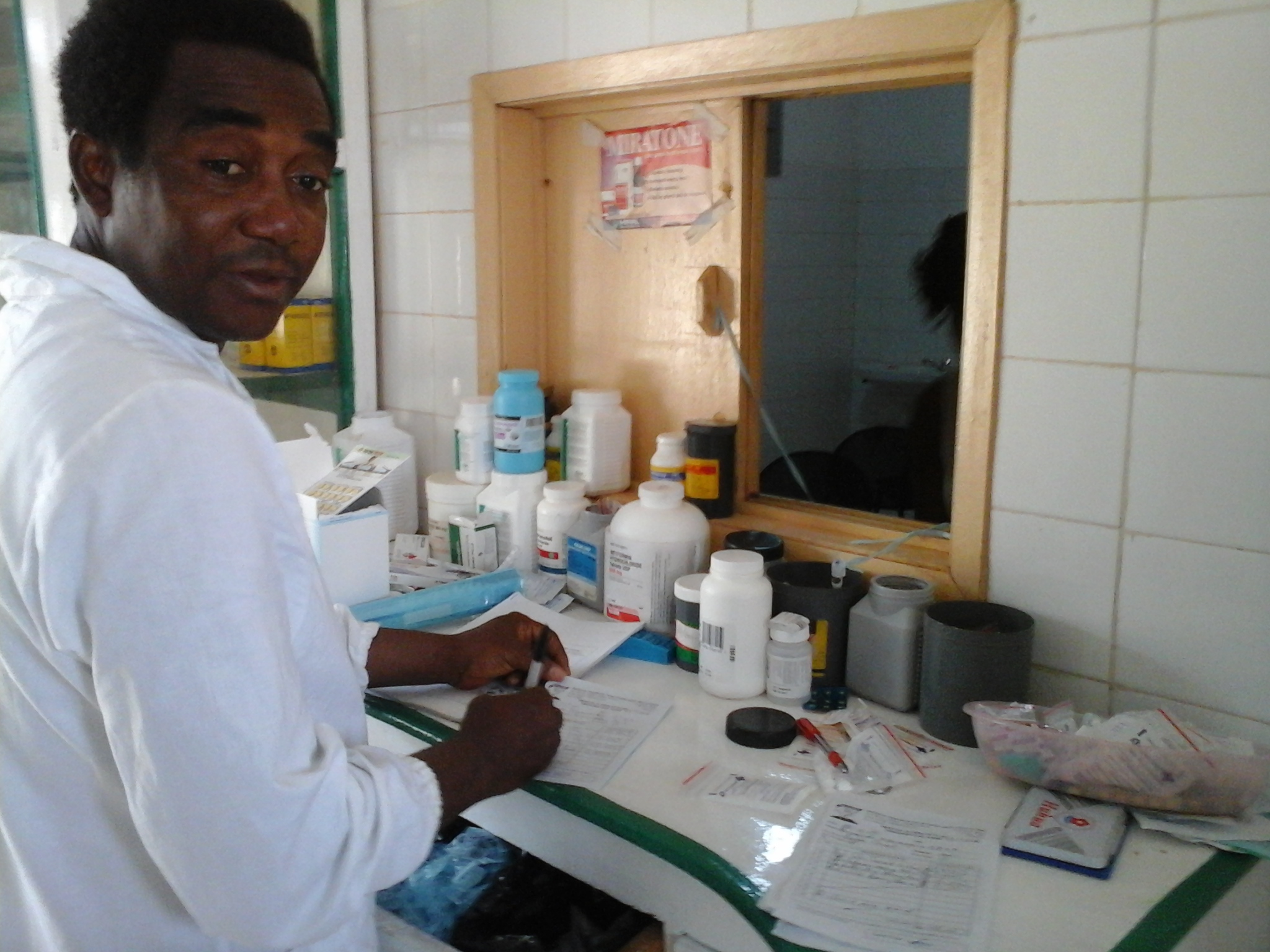 The pharmacist at Holy Spirit Catholic Hospital in Makeni dispenses medicines donated by Direct Relief.