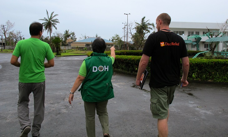 Inspecting typhoon damage to Ziga District Hospital with the Regional Health Director Dr. Balaboa & Albay PHO - Paint