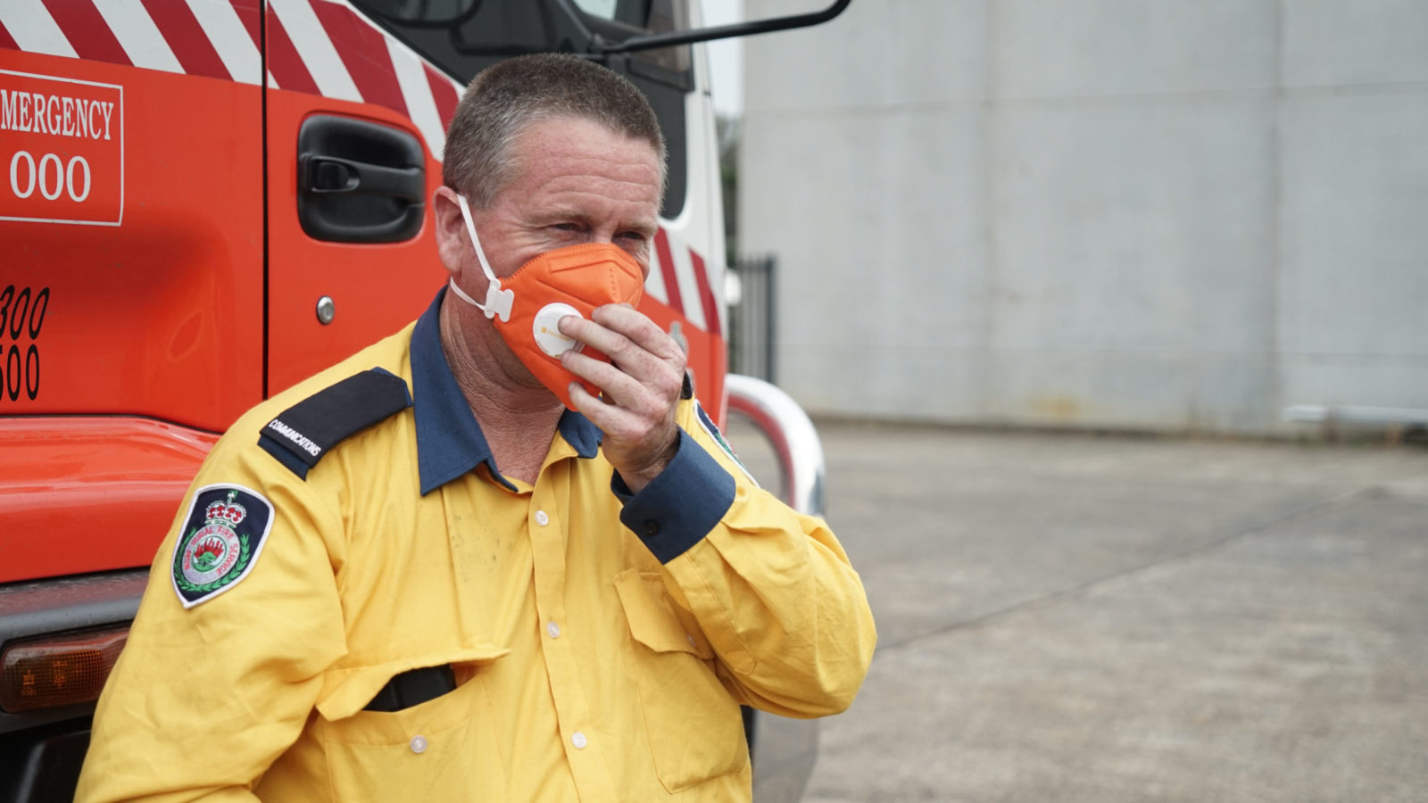 Firefighter Kurt Hill of Albian Park Rural Fire Service loads 15,000 masks on Jan. 16, 2020, in Picton, New South Wales, Australia. The area has been seriously impacted by bushfires and 30 homes have been lost in the surrounding area since Oct. 2019. The masks would go to fire crews and community members still enduring poor air quality. (Lara Cooper/Direct Relief)