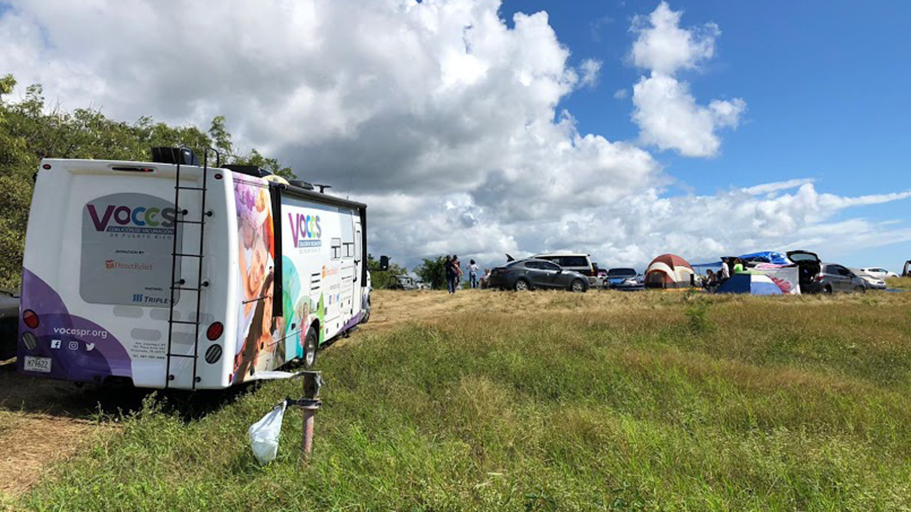 A mobile clinic from the organization VOCES positioned at the Los Indios camp in Guayanilla, Puerto Rico. Evacuees lived at the camp for more than two weeks, working together and receiving care at a mobile health outpost organized by Direct Relief. (Direct Relief photo)