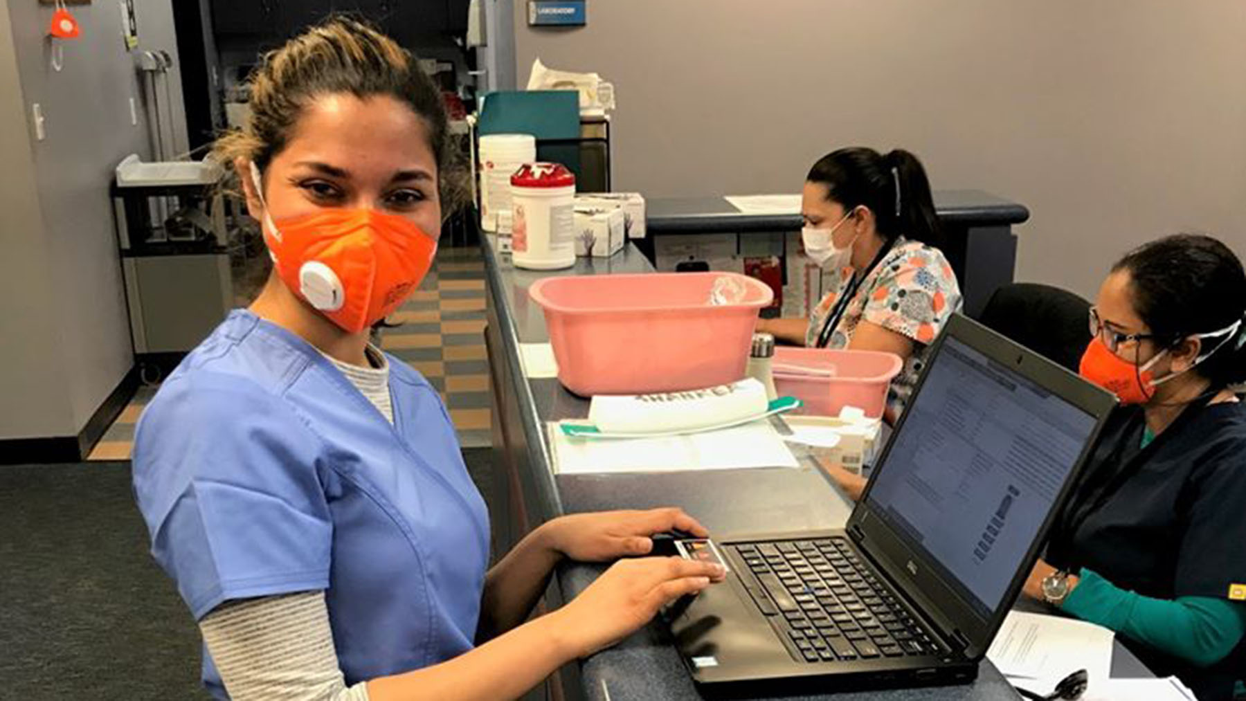 Dr. Vidushi Shanker updates patient records after an appointment at Brockton Neighborhood Health Center's COVID-19 Clinic on April 1. (Photo courtesy of BNHC)