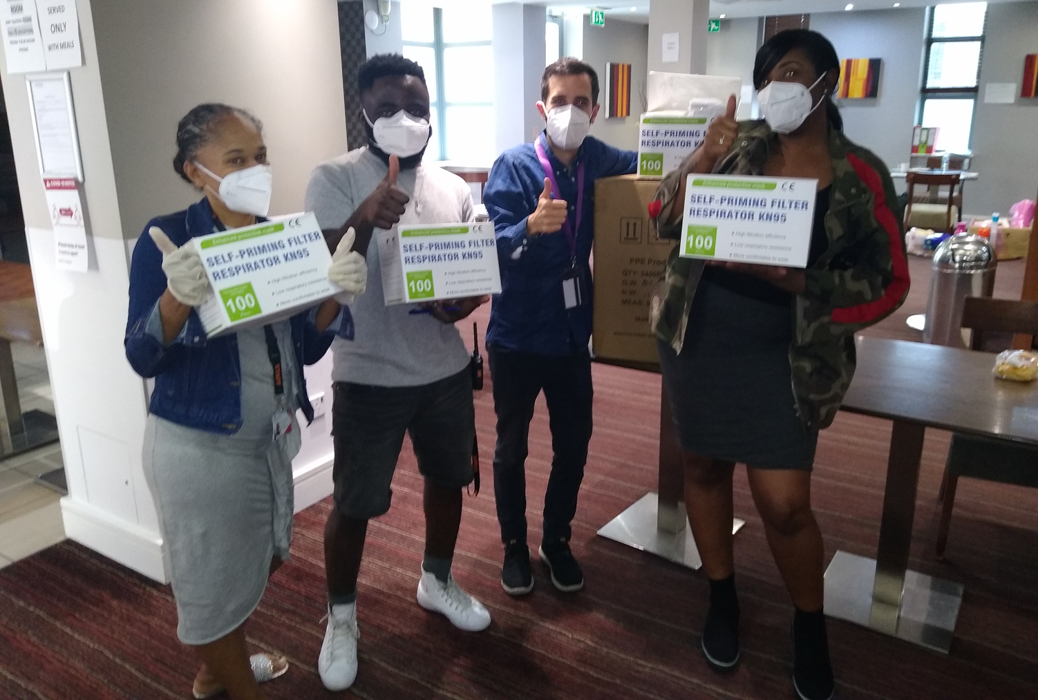 Staff members at an InterContinental Hotel in London with KN95 masks donated by Direct Relief. (Courtesy Photo via the Greater London Authority)