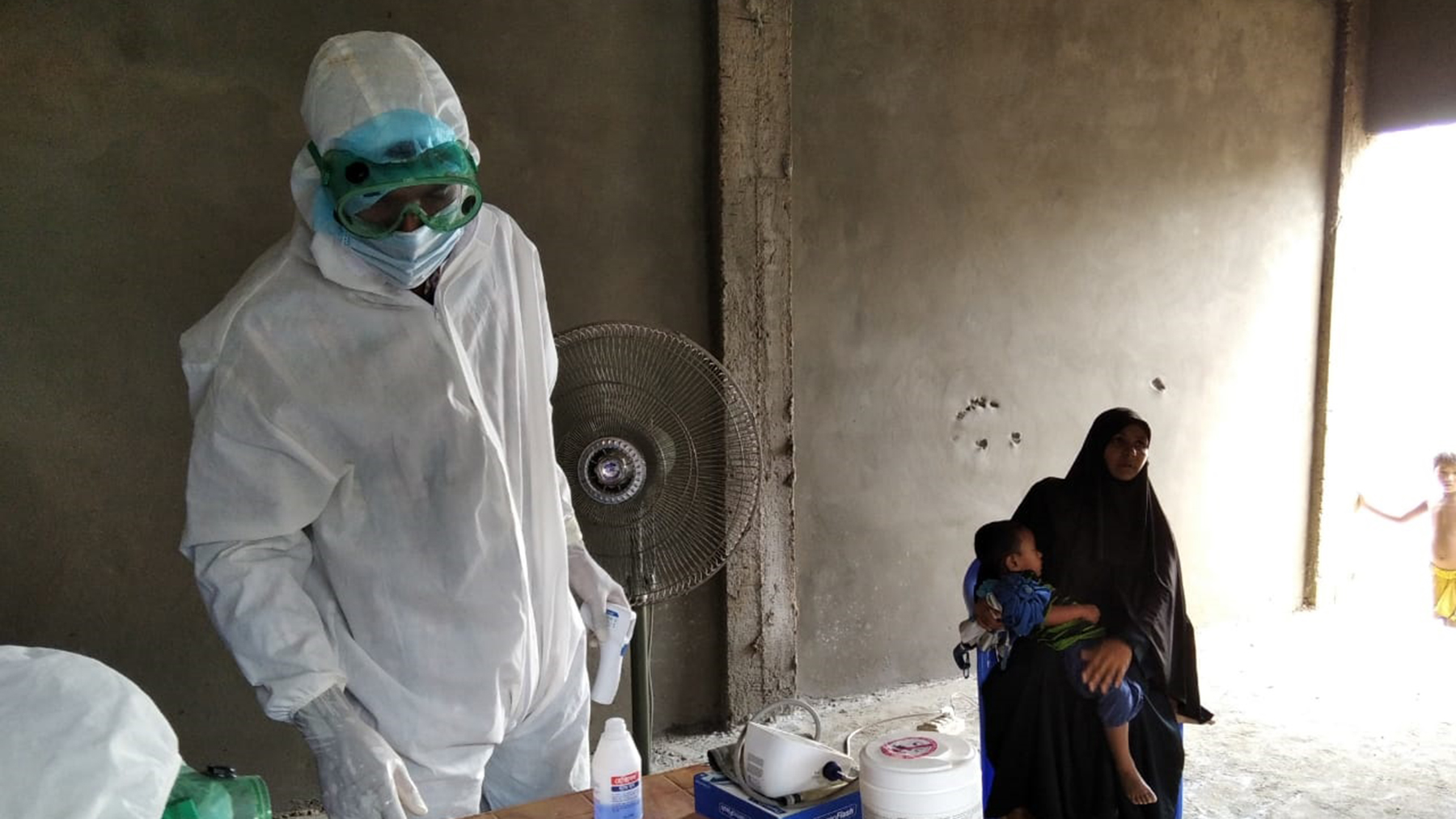 A health worker consults with a colleague at the HOPE for Women and Children of Bangladesh's field hospital. (Photo courtesy of Dr. Iftikher Mahmood)