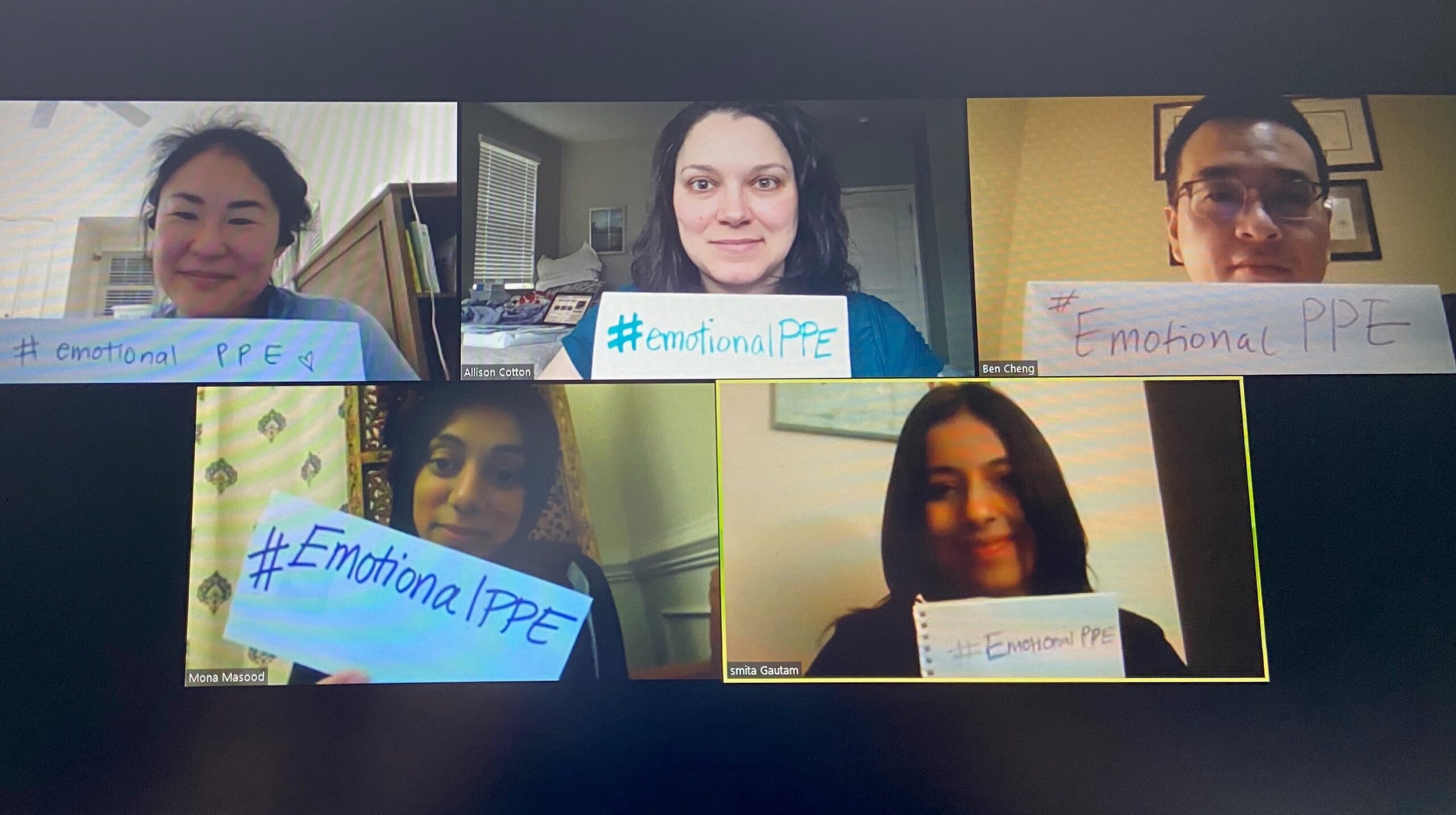 Psychiatrists at the Physician Support Line hold signs. The hotline provides 24-hour support to physicians who call in. (Photo courtesy of Mona Masood)