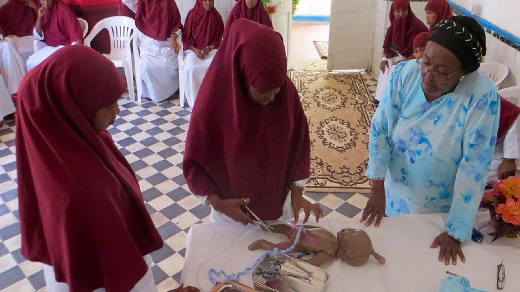 Edna Adan, founder of the Edna Adan University Hospital and a prominent women's health advocate, oversees a student midwife. (Photo courtesy of Edna Adan)
