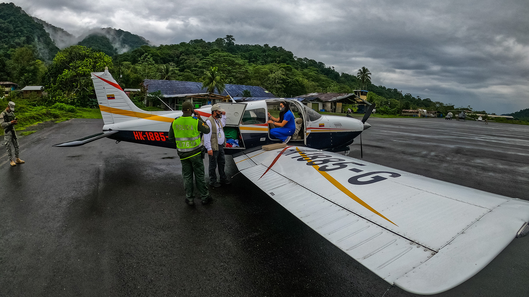 Volunteers and medical workers unload Covid-19 supplies in rural Colombia. (Photo courtesy of PAC)
