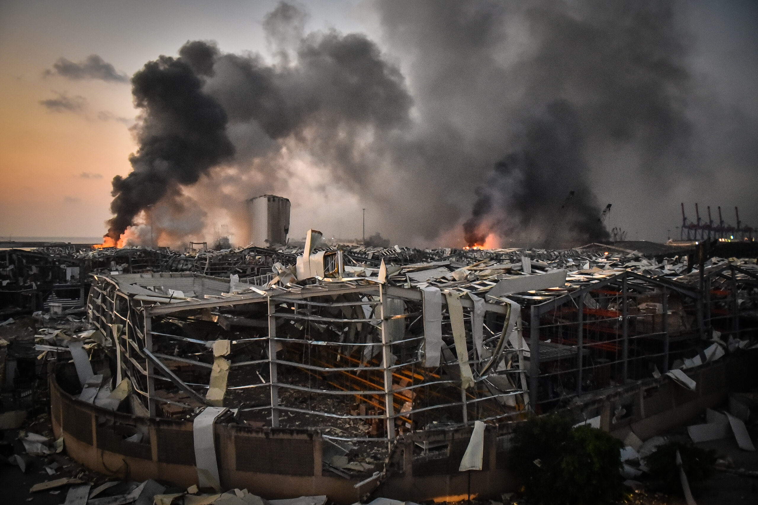Smoke rises from the port after the explosion on August 4, 2020 in Beirut, Lebanon. According to the Lebanese Red Cross, at the moment over 100 people died in the explosion and over 4,000 were injured in explosion at Beirut Port. Officials said a waterfront warehouse storing explosive materials, reportedly 2,700 tons of ammonium nitrate, was the cause of the blast.(Photo by Fadel Itani/NurPhoto via Getty Images)