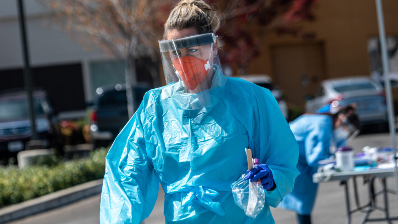 Staff with Ampla Health Care conduct Covid-19 testing at a drive-through site in Yuba City, California, on Friday, March 27, 2020. The site was provided with protective gear from Direct Relief. (Photo by Renée C. Byer/ZUMA Wire)