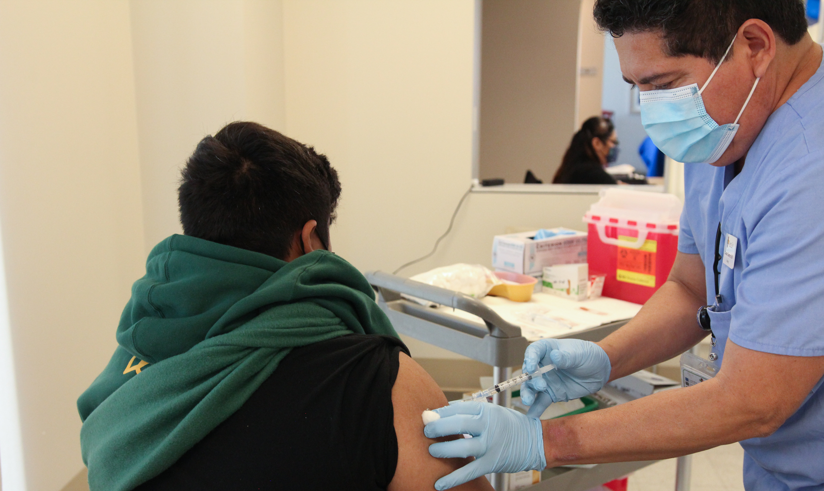 Flu vaccinations are administered at a flu clinic at QueensCare Health Center on Nov. 9, 2020. Health workers are urging communities to minimize their risk of seasonal flu as the nation sees Covid cases on the rise.(Noah Smith/Direct Relief)
