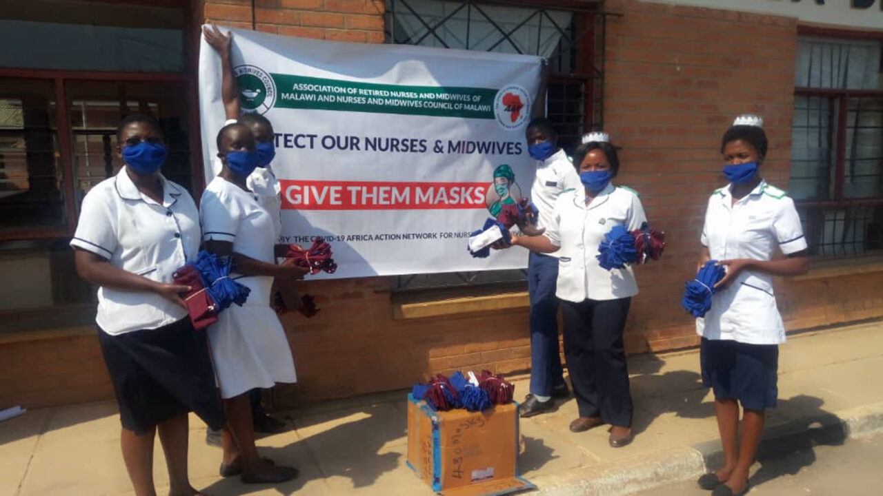 Nurses in Malawi holding masks they made during the pandemic. (Photo courtesy of AAN)