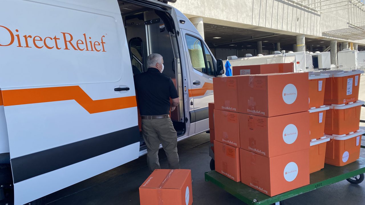 A Direct Relief staff member unloads medical aid at the San Diego Convention Center where thousands of migrant children will receive medical care and shelter. (Martin Calderon/Direct Relief)
