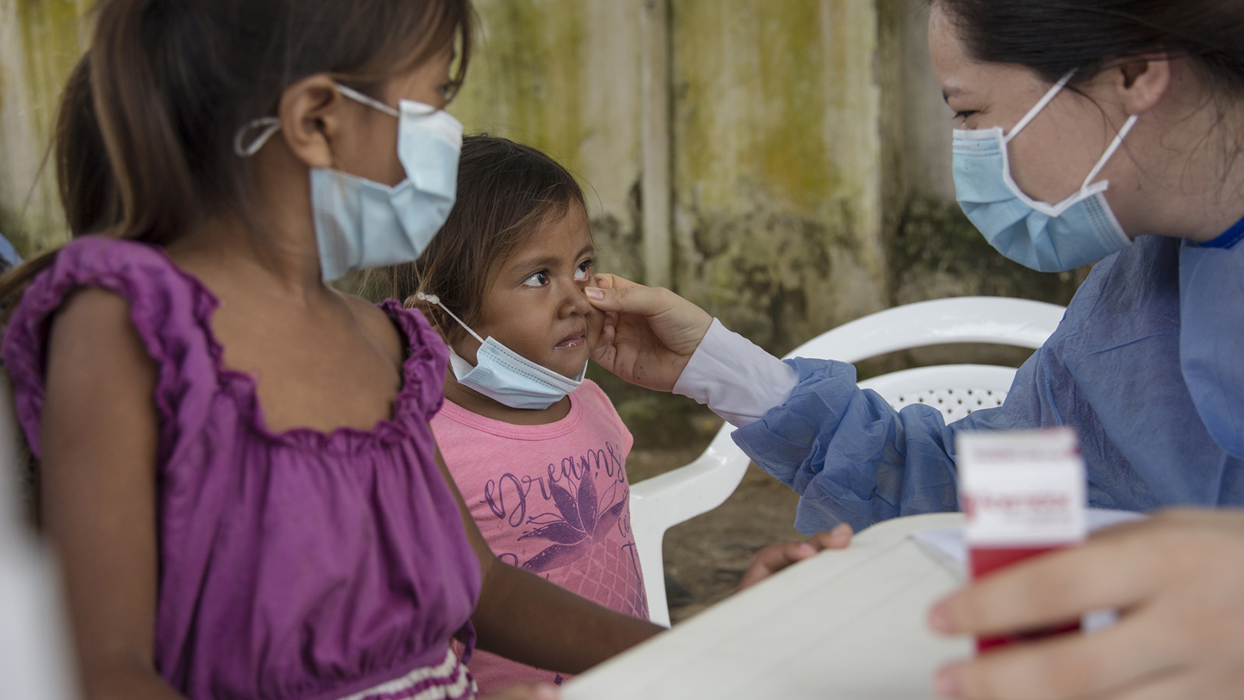 A health provider examines a young patient in Catatumbo, Colombia, in April 2021. The health outreach was supported by nonprofit Banco de Medicamentos, which Direct Relief has provided with funding and medical support. Over the past weekm more than $1.2 million in medical aid has departed for health facilities in Colombia. (Photo by Oscar Castillo for Direct Relief)