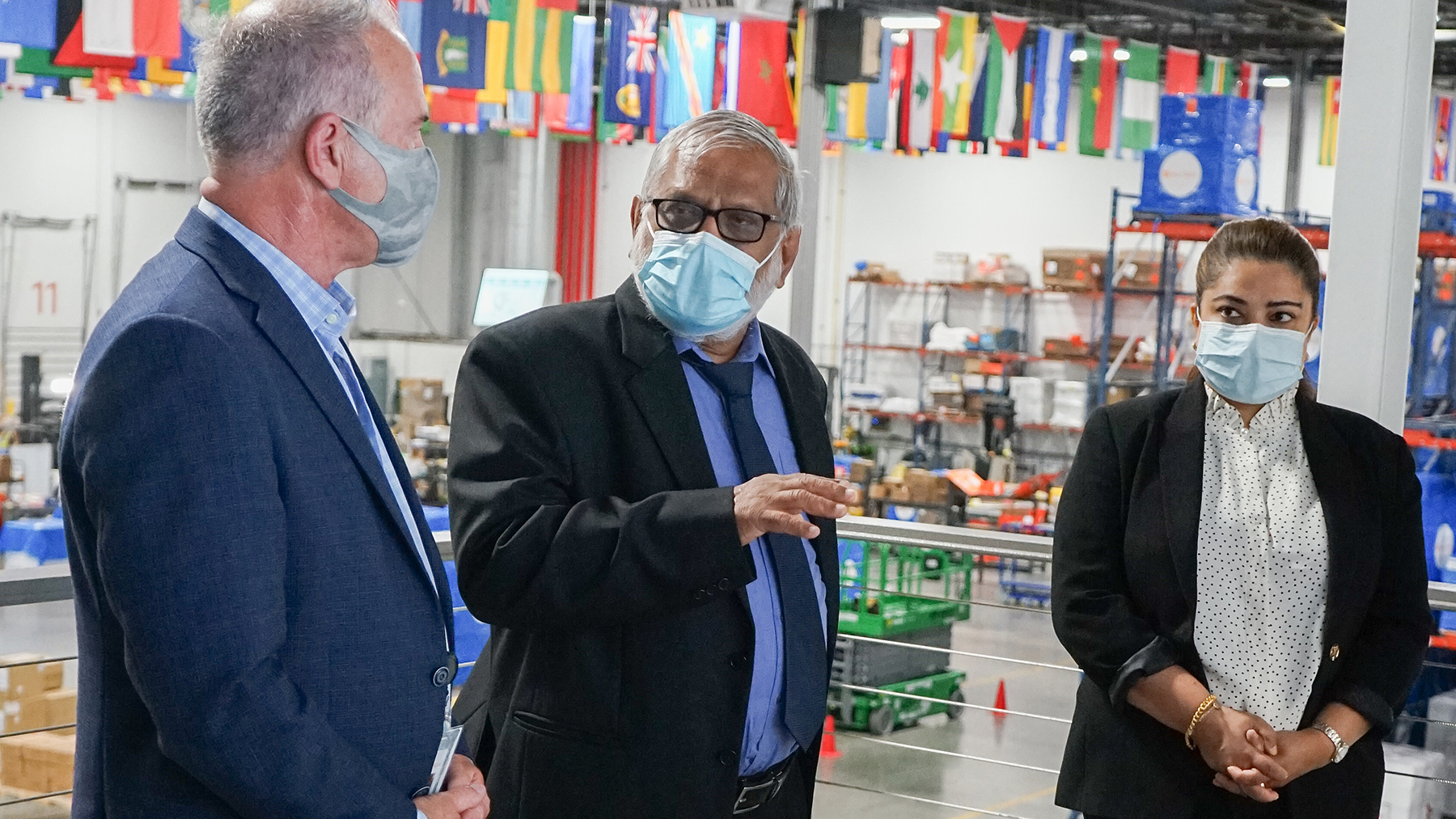 Honorable Dr. Lalith Priyalal Chandradasa, Consul General of Sri Lanka, (center) speaks with Direct Relief CEO Thomas Tighe and Aruni Boteju during a visit to Direct Relief’s Santa Barbara headquarters on July 19, 2021. (Maeve O'Connor/Direct Relief)
