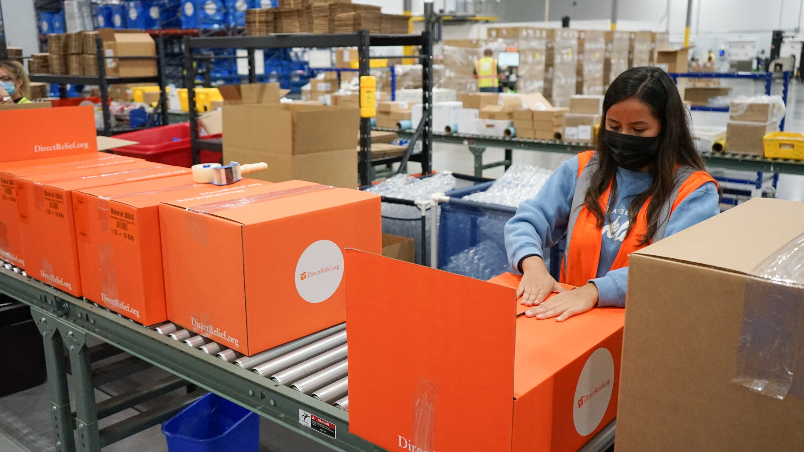 Emergency medical aid is prepped and packed for wildfire impacted communities in California and flood damaged areas of Tennessee on August 24, 2021, at Direct Relief's warehouse. The shipments contained insulin, inhalers, Emergency Medical Backpacks for triage care, and personal care products for evacuees and more. (Lara Cooper/Direct Relief)