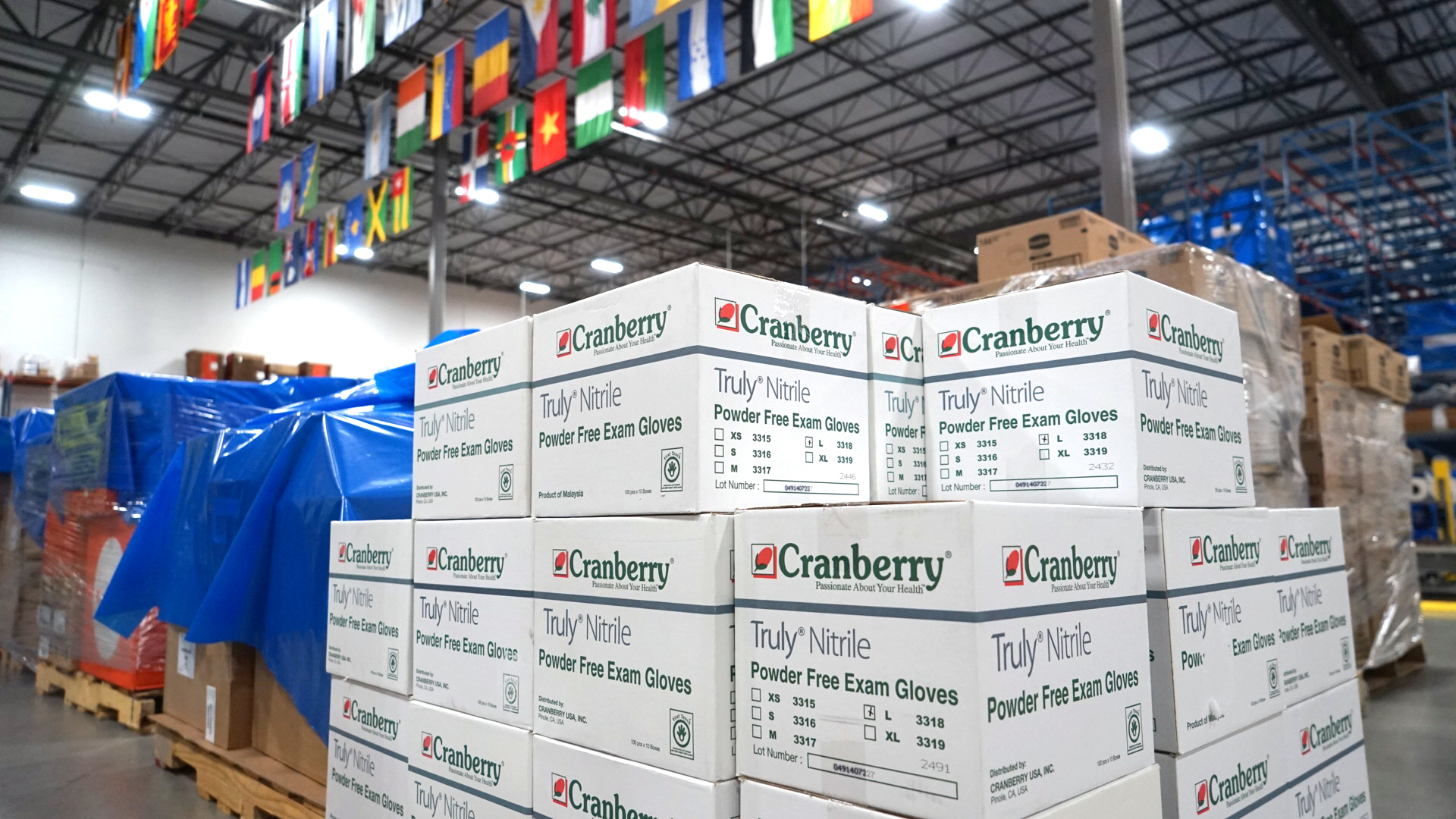 Sterile exam gloves are staged for shipment to clinics in the DRC. Gloves and protective gear are essential for protection of healthcare workers treating patients with Ebola. (Bryn Blanks/Direct Relief)