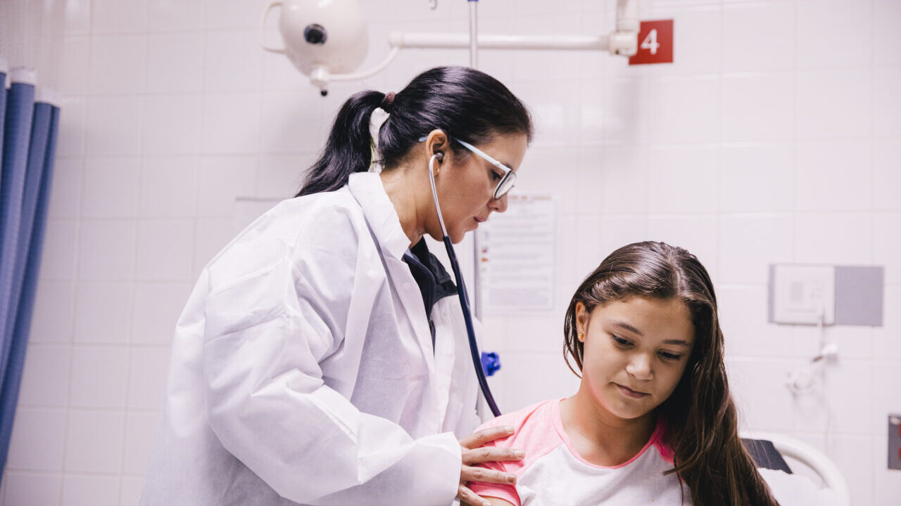 Doctor treating a young patient in Puerto Rico.