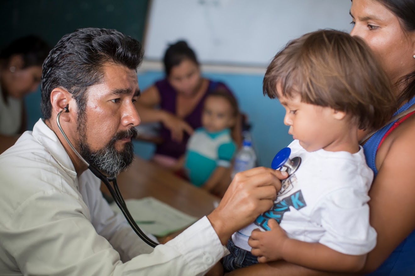 Doctors take care of patients as part of a medical volunteer campaign supported by Vida Peru, Direct Releif among other organizations, to help villagers affected by floods, in Batanes, Piura on April 9, 2017.